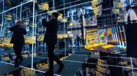 Man taking a picture in a hall of mirrors at CES