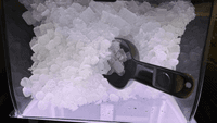 Close up photo of ice with scooper.