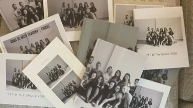 Several photo books strewn across a couch
