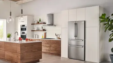 Modern kitchen with stainless steel fridge