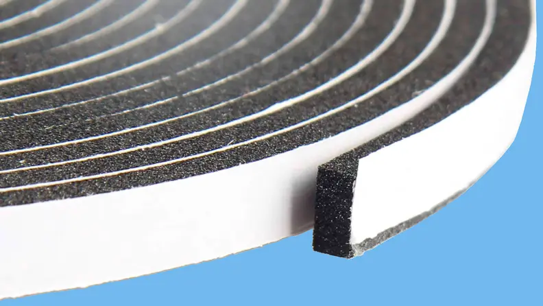A coil of adhesive foam weatherstripping.