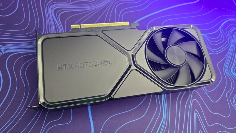 The Nvidia RTX 4070 system on a purple and blue mat.