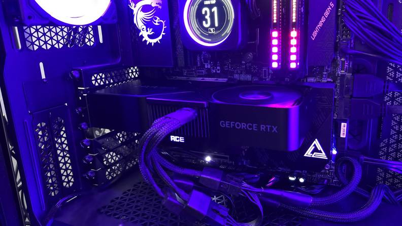 The Nvidia RTX 4070 installed with a purple light surrounding the system.