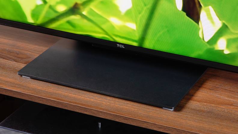 A close-up of the bottom of the screen of a TCL QM8 LED TV.