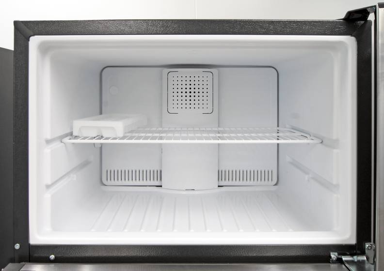 Inside the GE GTE16GSHSS's freezer, you get one adjustable shelf and a small ice cube tray.