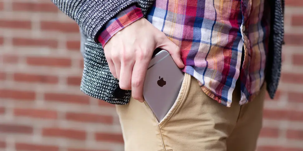 An iPhone 6s Plus trying desperately to fit into a pocket