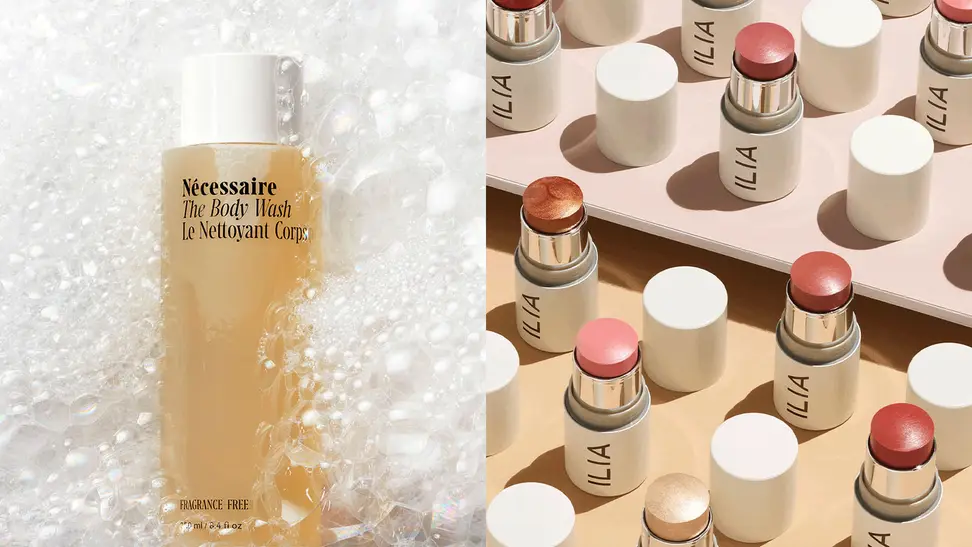 The Nécessaire Body Wash surrounded by bubbles and the Ilia Beauty Multi-Sticks standing on a tabletop.